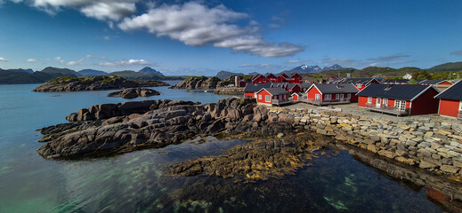 Picturesque Red Rorbuer Huts At The Coast On Lofoten Islands In Norway