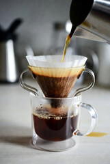 Manual Pour-Over Coffee Brewing into a Glass Mug