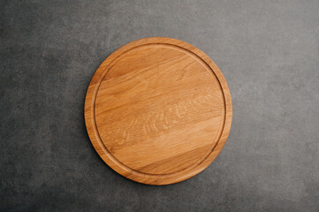 Meat or bread cutting board for homemade baking on table. Food recipe concept at stone background texture with copy space. Flat lay top view