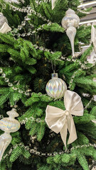 Festive Scandinavian Christmas Tree with White Silver Ornaments.
