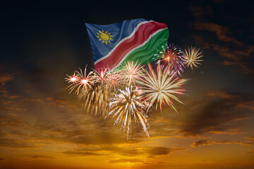 Flag of Namibia and Holiday fireworks in sky