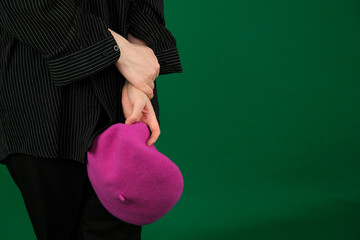 Photo of overjoyed glad petty lady inside pink paper hole open arm glad inviting welcome see you here isolated on beige color background. High quality photo