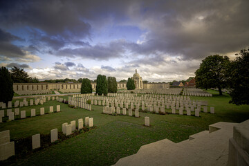 Tyne Cot Cemetery and Memorial in Zonnebeke, Belgium : stormy sky emphasizing the emotional weight of the "silent witnesses ".