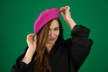 Photo of overjoyed glad petty lady inside pink paper hole open arm glad inviting welcome see you here isolated on beige color background. High quality photo