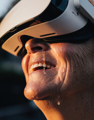 Emotional close up of happy senior woman smiling with tears of joy. Her face shows pure delight while wearing virtual reality headset for futuristic experience