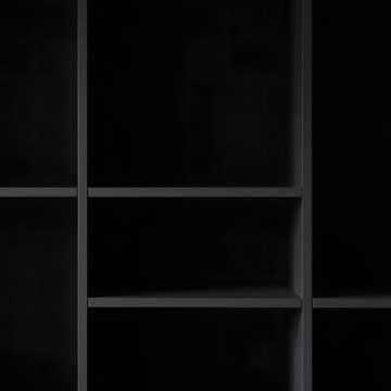 Dark gray empty bookshelf with multiple compartments