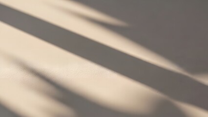 Minimalist abstract background featuring soft beige texture with elegant diagonal sunlight shadows.