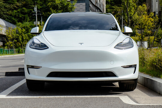 October 3, 2021, Seoul, South Korea - A white Tesla Model Y electric vehicle parked in an outdoor parking lot.