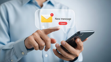 Man interacting with smartphone and notification message on screen in blue shirt