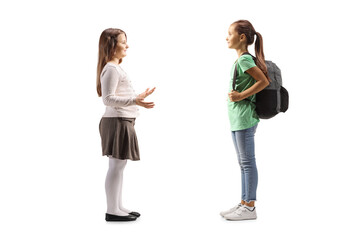 Fototapeta premium Full length profile shot of two girls having a conversation