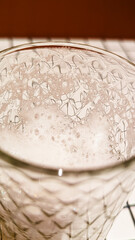 Glass of White Beer on Empty Tile Table. Beverage Indoor Closeup
