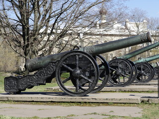 row of bronze medieval cannons, richly decorated