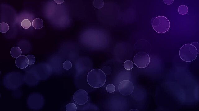 Abstract purple bokeh background animation of floating circular light particles.