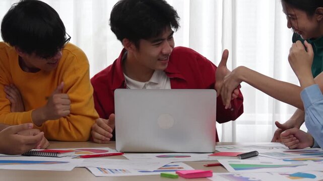 Excited and happy startup company employee shake hand after make successful strategic business marketing planning. Teamwork and positive attitude create productive and supportive workplace. Synergic