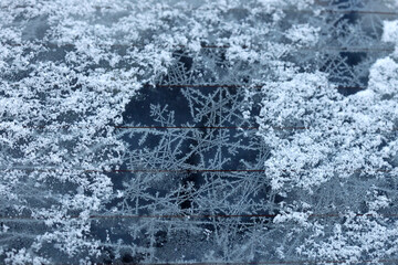White snowflakes on car glass