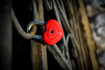 A small red heart-shaped padlock. A decorative lock as a symbol of eternal love. for St. Valentine&rsquo;s Day marketing, wedding anniversary, articles on relationship, social media content.