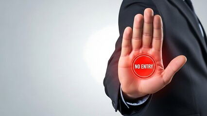 Businessman displaying a refusal gesture with a no entry sign on his palm