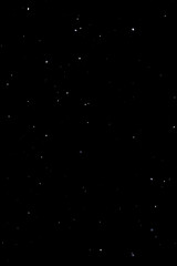 Medium snowfall overlay on black background with floating snowflakes. High quality photo