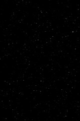 Heavy snow overlay on black background, dense snowfall particles. High quality photo