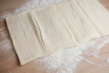 Making dough on a flat surface during a baking session in a kitchen