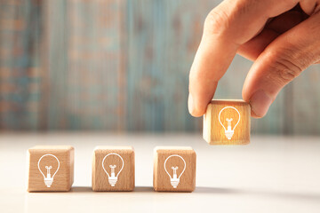 hand holding light bulb with idea icon. innovation concept
