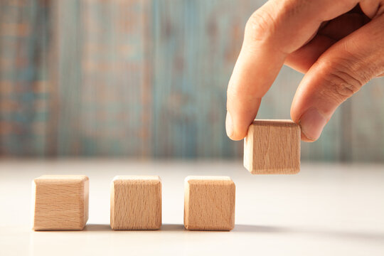 business strategy concept. wooden cubes in hand