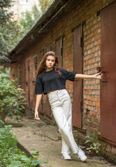 Full body portrait of a young beautiful brunette girl