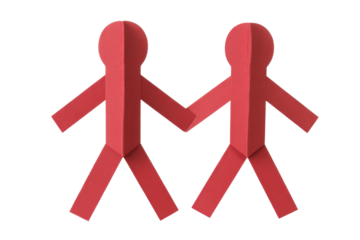 Two red paper people holding hands. isolated