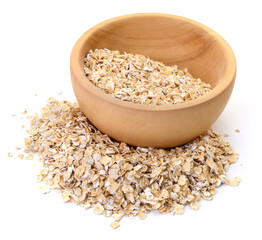 Oat flakes in wooden bowl isolated on white