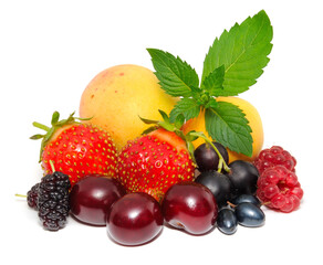 Assorted summer fruits and berries isolated on white
