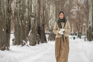 Fototapeta premium Winter portrait of a middle-aged brunette model