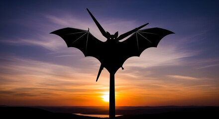 Mysterious Bat Silhouette Against a Fiery Sunset Sky, Capturing the Tranquil Beauty of Dusk and Nature's Creatures