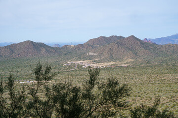 The famous Phoenix Arrow sign written on a mountain directing air traffic and planes as seen from Mesa and Usery Mountain Park