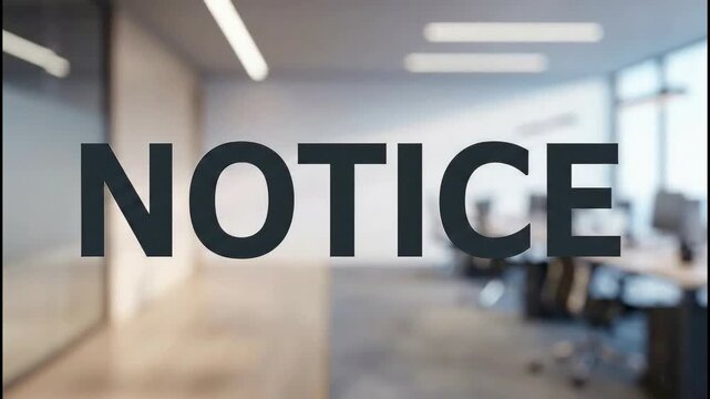 A clear and prominent 'NOTICE' sign displayed on a glass door of a modern office space, inviting attention to an announcement or important information