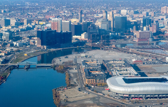 Aerial view of Newark, New Jersey shows a dense urban landscape with a mix of modern skyscrapers and older buildings.