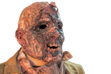 Close-up image of a burnt mask on an unseen face, neutral expression, soft lighting, nondescript background.