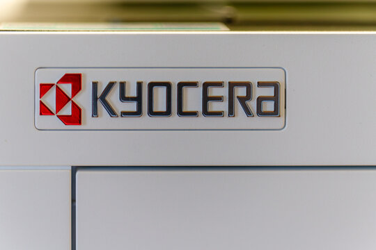 Kyocera brand logo on modern office printer