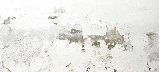 Peeling painted concrete wall. Leaking rain cause the wall and ceiling cracked.