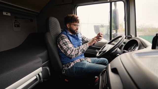 Professional truck driver checking route
