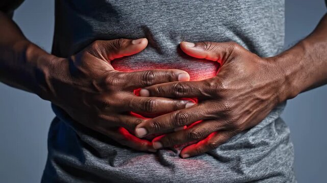 Man Suffering from Severe Abdominal Pain and Stomach Ache, Hands on Belly with Red Highlight.