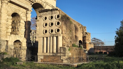 Rome, Italy - 14 January 2025. The tomb&rsquo;s grid of round niches and vertical shafts stands out near Porta Maggiore, with its detailed frieze and ancient brick backdrop in full sunlight.
