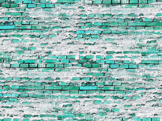 Fototapeta premium Textured brick wall with a teal-green color, covered with patchy white mortar. The wall's surface has a distressed appearance.