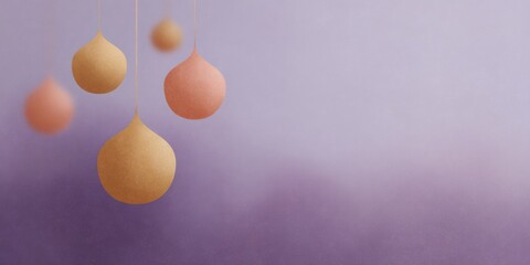 Purple background with four orange and yellow balls hanging from it