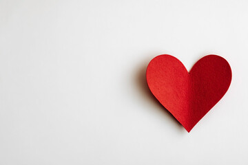 Obraz premium Minimal Red Heart on White Background with Copy Space