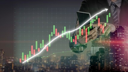 A businessman holds a mobile device while analyzing stock market trends with digital graphs overlaying a city skyline, emphasizing financial growth and technology role. Copula