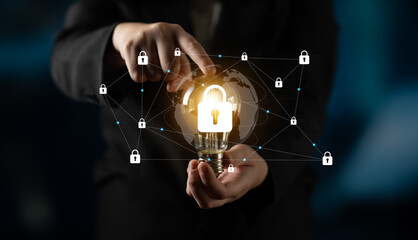 A business professional displays a light bulb surrounded by security locks and a network, highlighting innovation in cybersecurity and digital protection strategies. Gantry