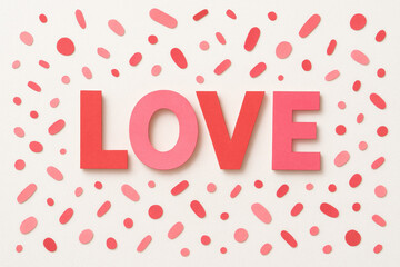 Love text with scattered pink confetti on white background, festive Valentine's Day celebration design
