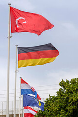 Turkey Germany Flags at Poles in Front of World Expo Conference Hall