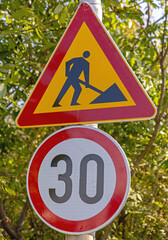 Thirty Speed Limit Road Works Traffic Signs at Pole