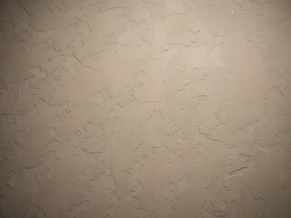 Textured cream wall background with subtle artistic relief patterns